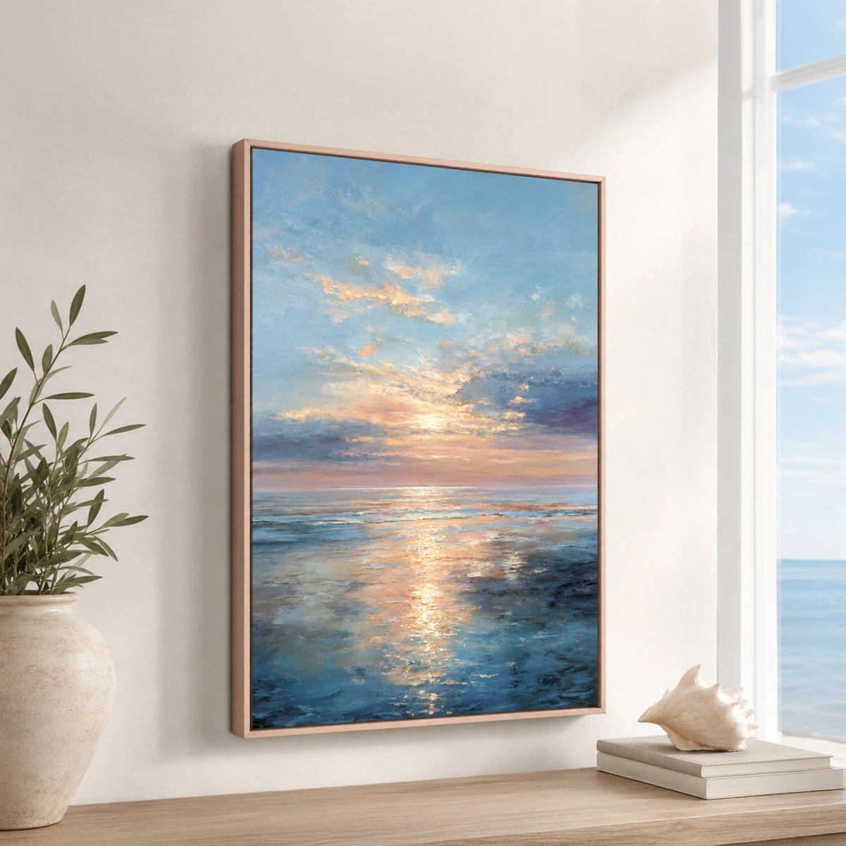 a large framed painting depicting a serene ocean scene with a sunset over the water.