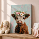 a painting of a cow wearing a flower crown, placed on a wooden shelf next to a stuffed bunny and a basket of baby clothes.