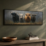 a painting of four yaks standing in a row on a wall, with a wooden bowl and some books placed on a wooden shelf below the painting.