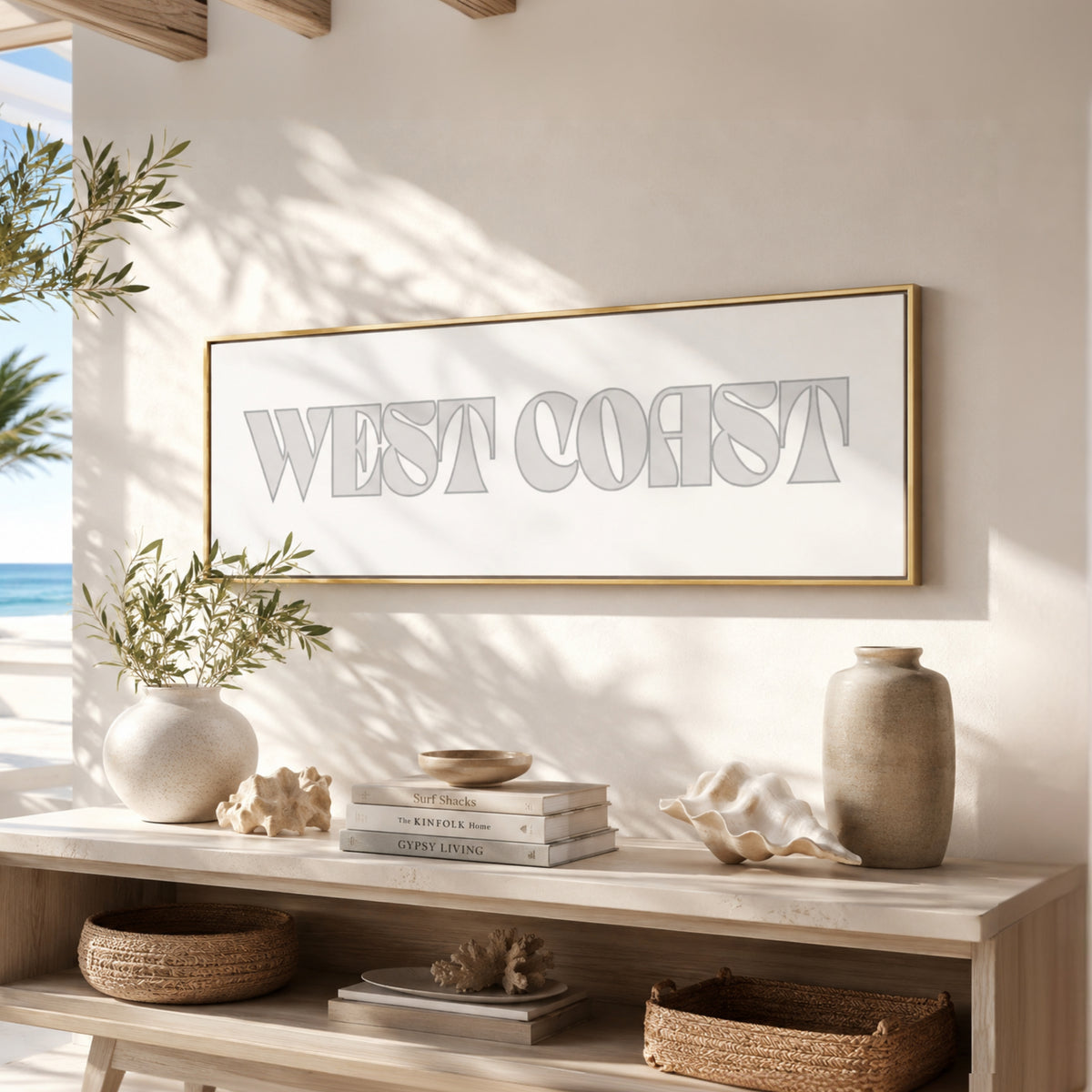 a minimalist and modern interior design with a large framed text "WEST COAST" on a white wall above a wooden shelf. The shelf is decorated with various items, including a vase, a stack of books, and a bowl. The overall color scheme of the image is neutral, with shades of white, beige, and brown.