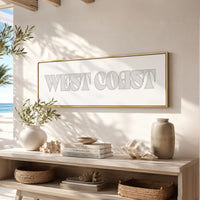 a minimalist and modern interior design with a large framed text "WEST COAST" on a white wall above a wooden shelf. The shelf is decorated with various items, including a vase, a stack of books, and a bowl. The overall color scheme of the image is neutral, with shades of white, beige, and brown.